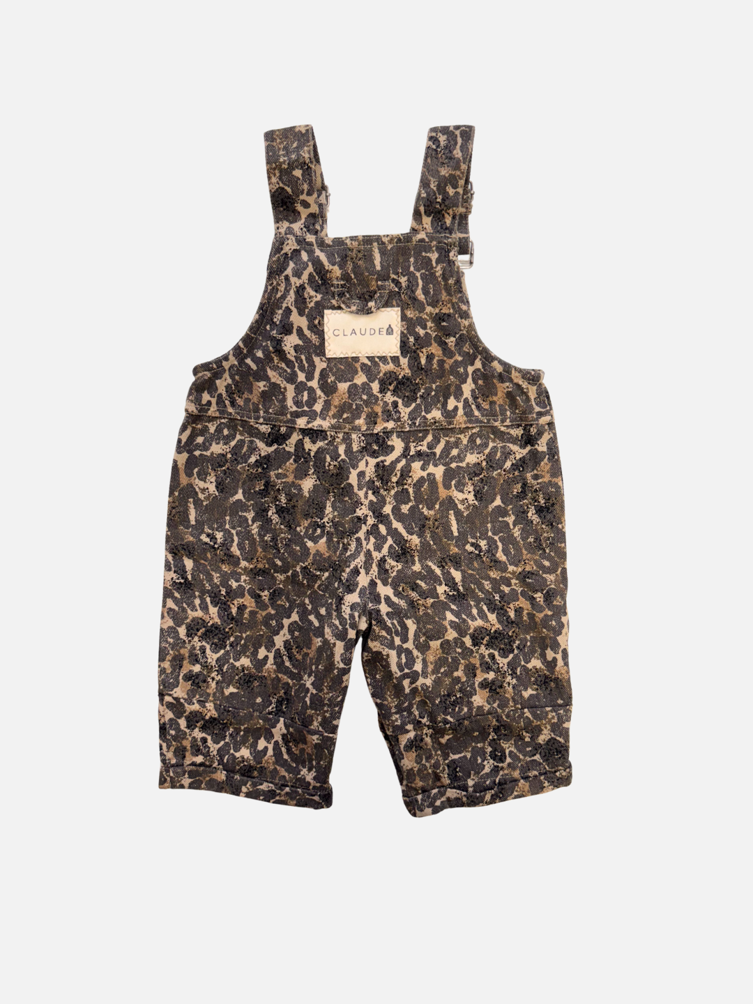 The BLYTHE LEOPARD DUNGAREE BABY features brown and black leopard-print overalls with adjustable straps and a CLAUDE label, made from organic cotton—an adorable unisex baby staple, shown on a white background.