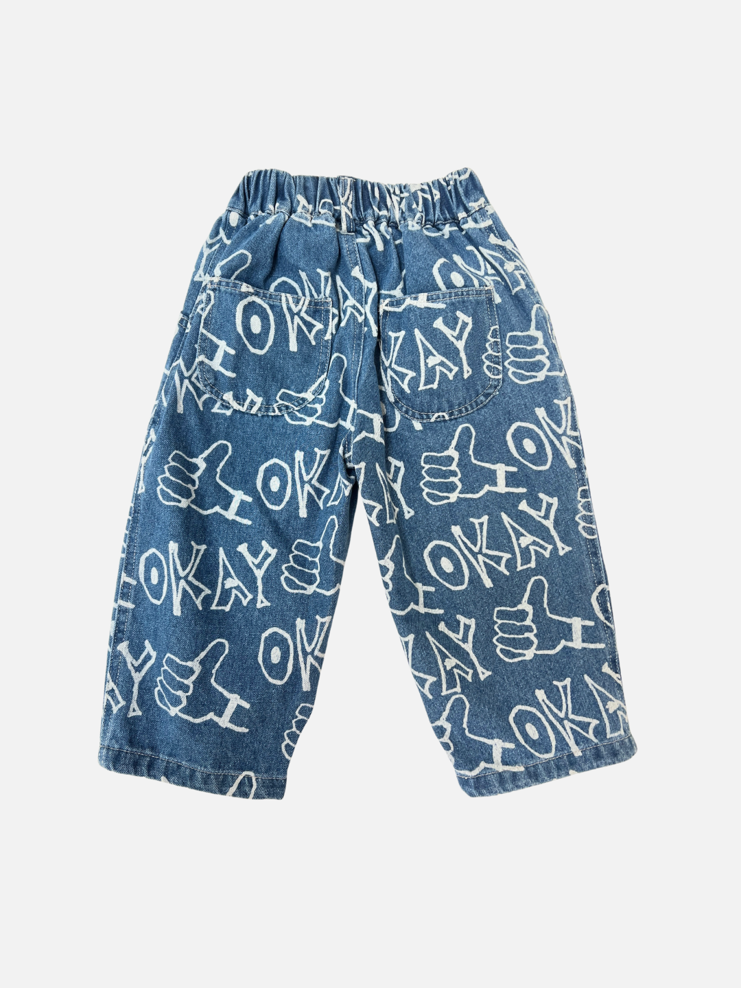 Blue | OKAY JEANS: Children’s blue denim baggy jeans with an elastic waistband, featuring an all-over white “OKAY” and thumbs-up graphic print.