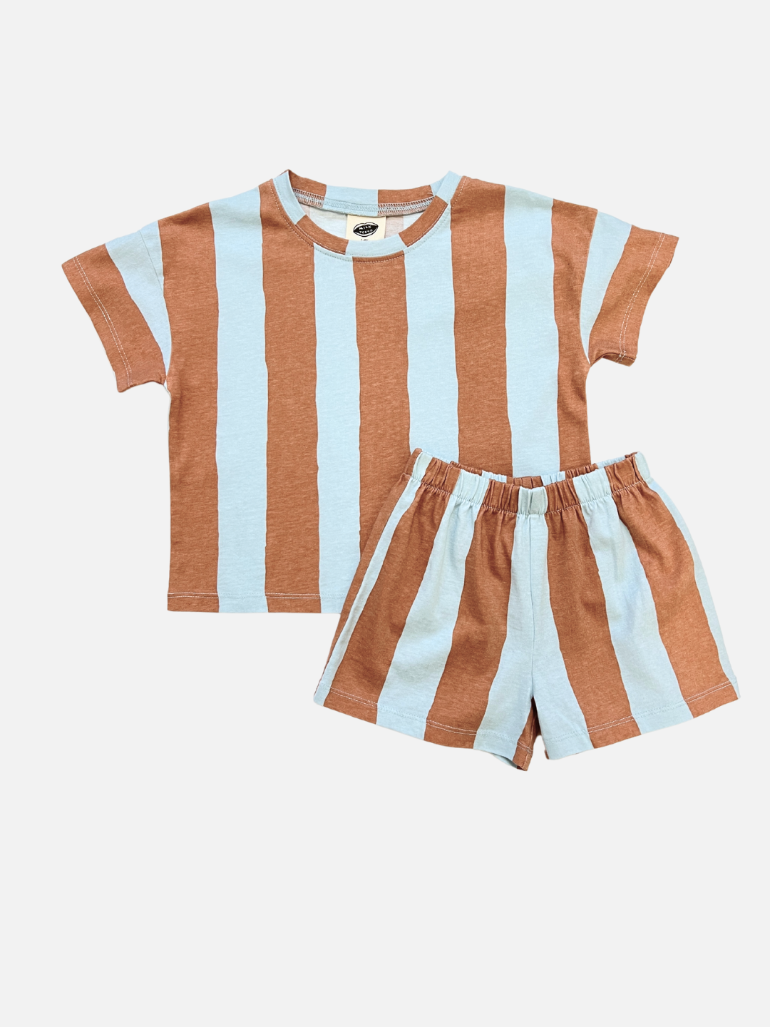 The UMBRELLA STRIPE SHORT SET is a unisex blue/brown matching play set with vertical stripes, including a short-sleeve shirt and shorts in organic cotton. The striped set is shown laid flat on a white background.