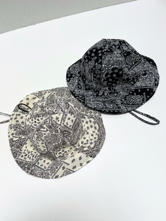 Second image of White | Paisley bandana patterned baby bucket hat with a strap on a white background