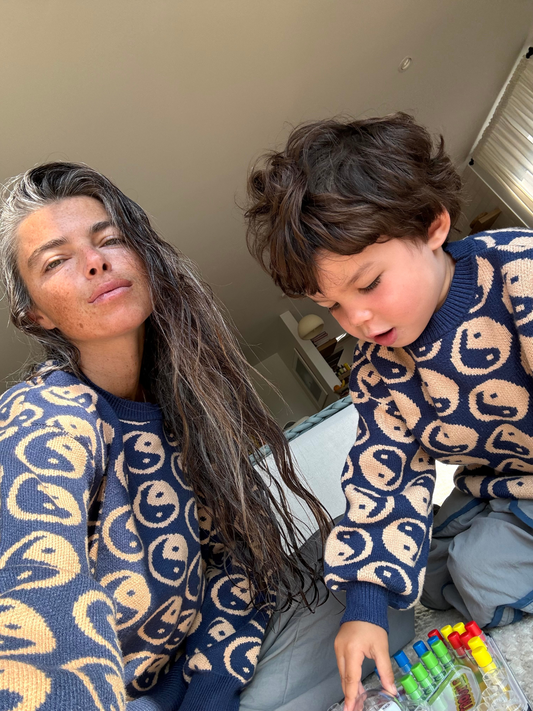Second image of Blue sweater with beige yin yang symbols pattern on a white background