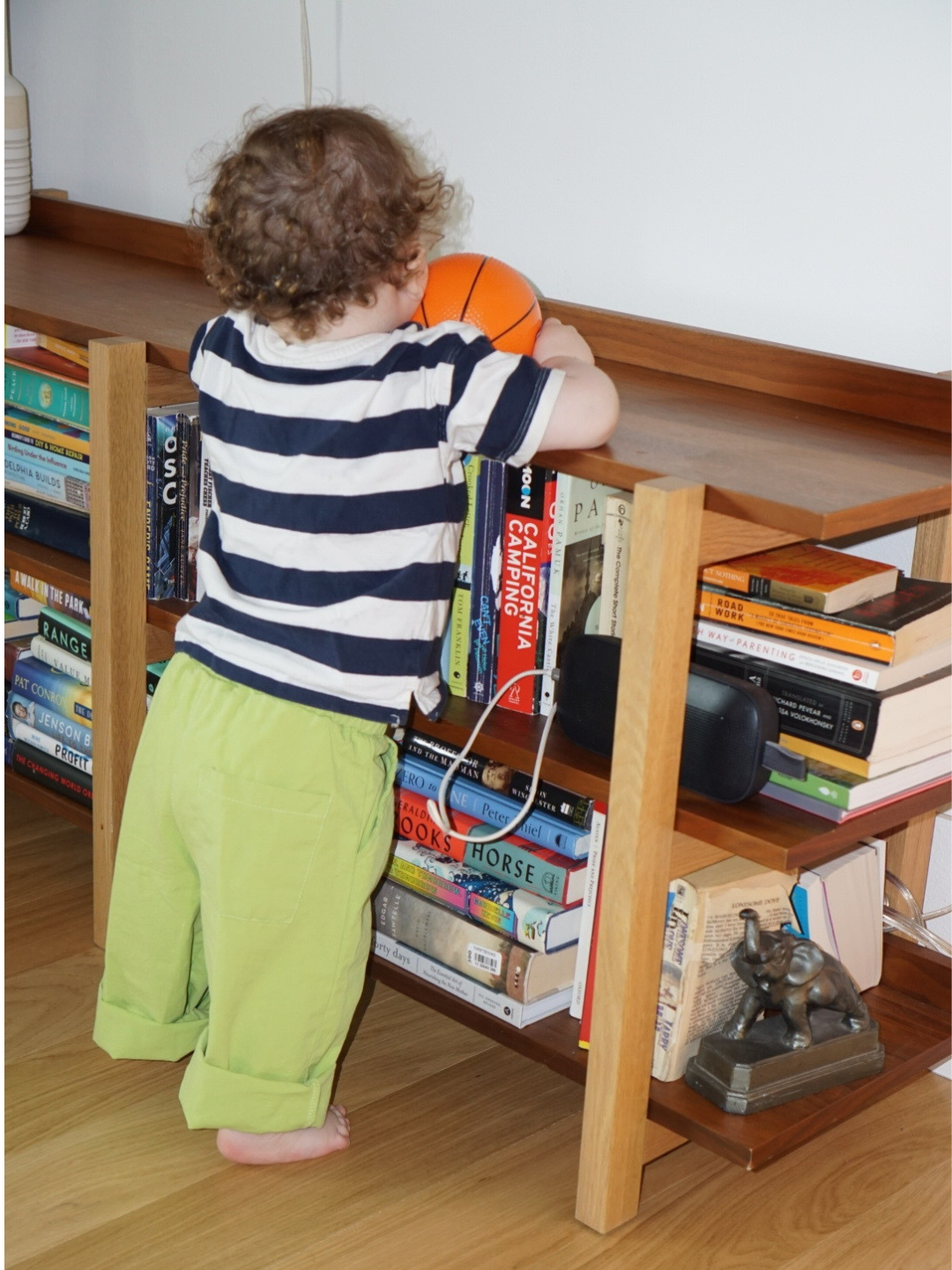 Green | A child is wearing green jelly pants with a striped tee
