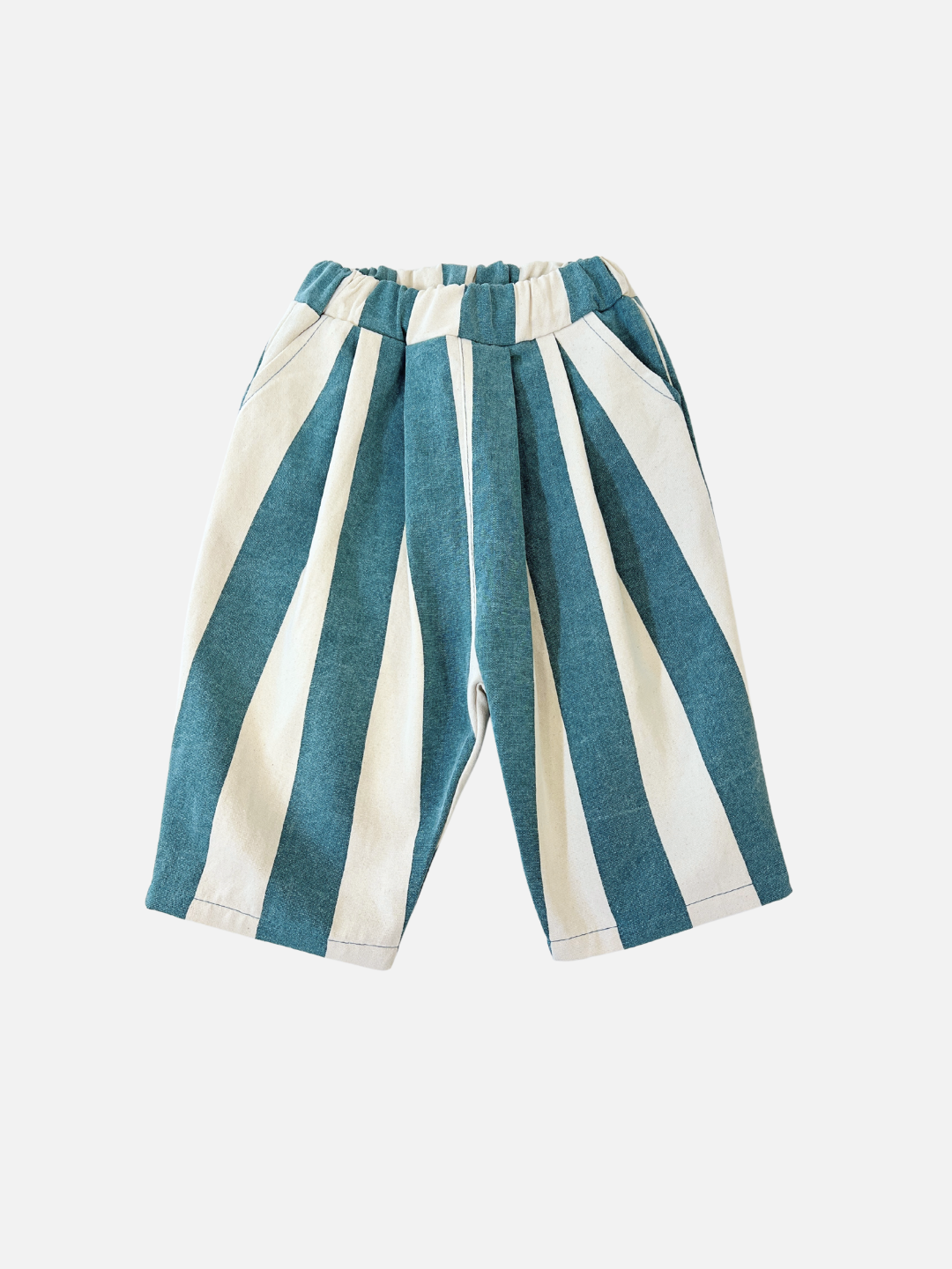 Teal | The BIG STRIPE PANTS for toddlers boast delightful teal and white summery stripes, crafted from lightweight cotton canvas. They feature an elastic waistband for comfort, presented on a plain white background.