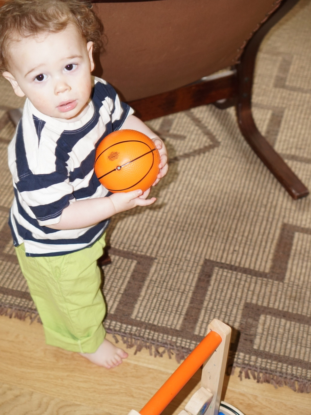 Green | A child is wearing green jelly pants with a striped tee