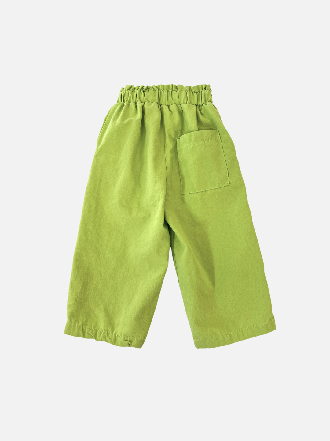 Green | The JELLY PANTS, in bright green from a popular Korean kids brand, feature an elastic waistband and single back pocket. Made of woven cotton, they're showcased on a plain white background.