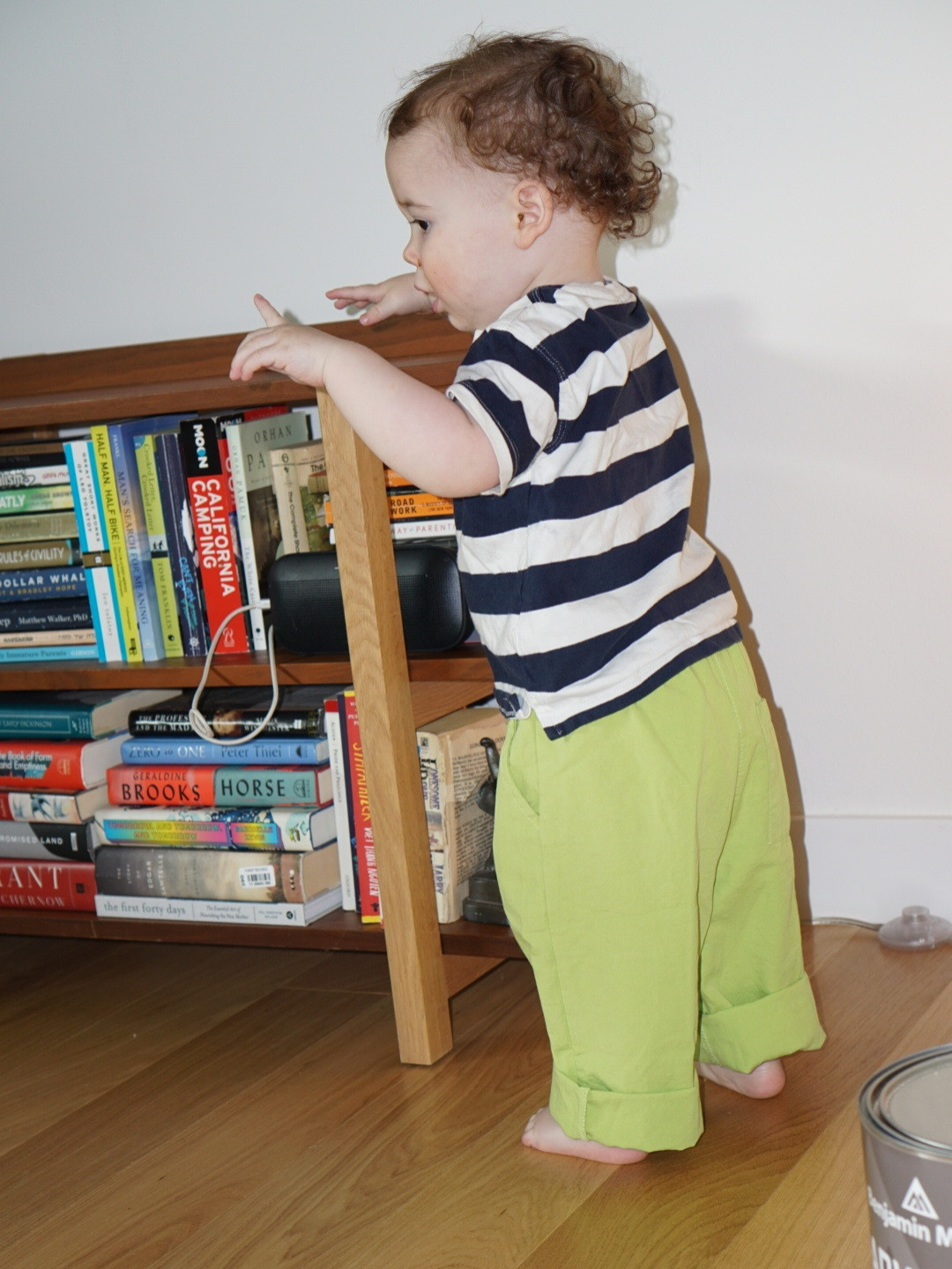 Green | A child is wearing green jelly pants with a striped tee