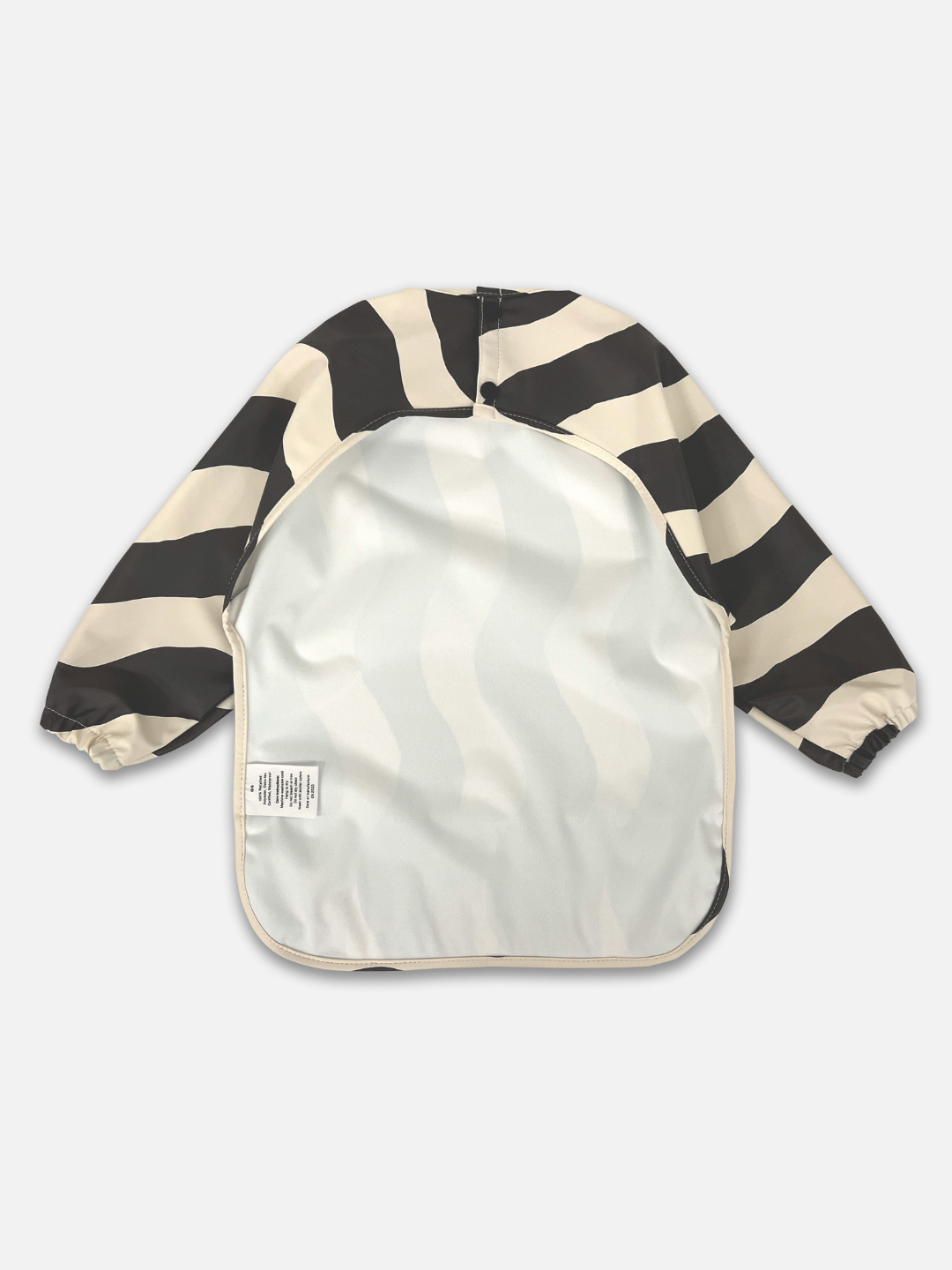 Black Waves | Back view of the long sleeve black and white wavy bib and a back cut out with two buttons for closure.