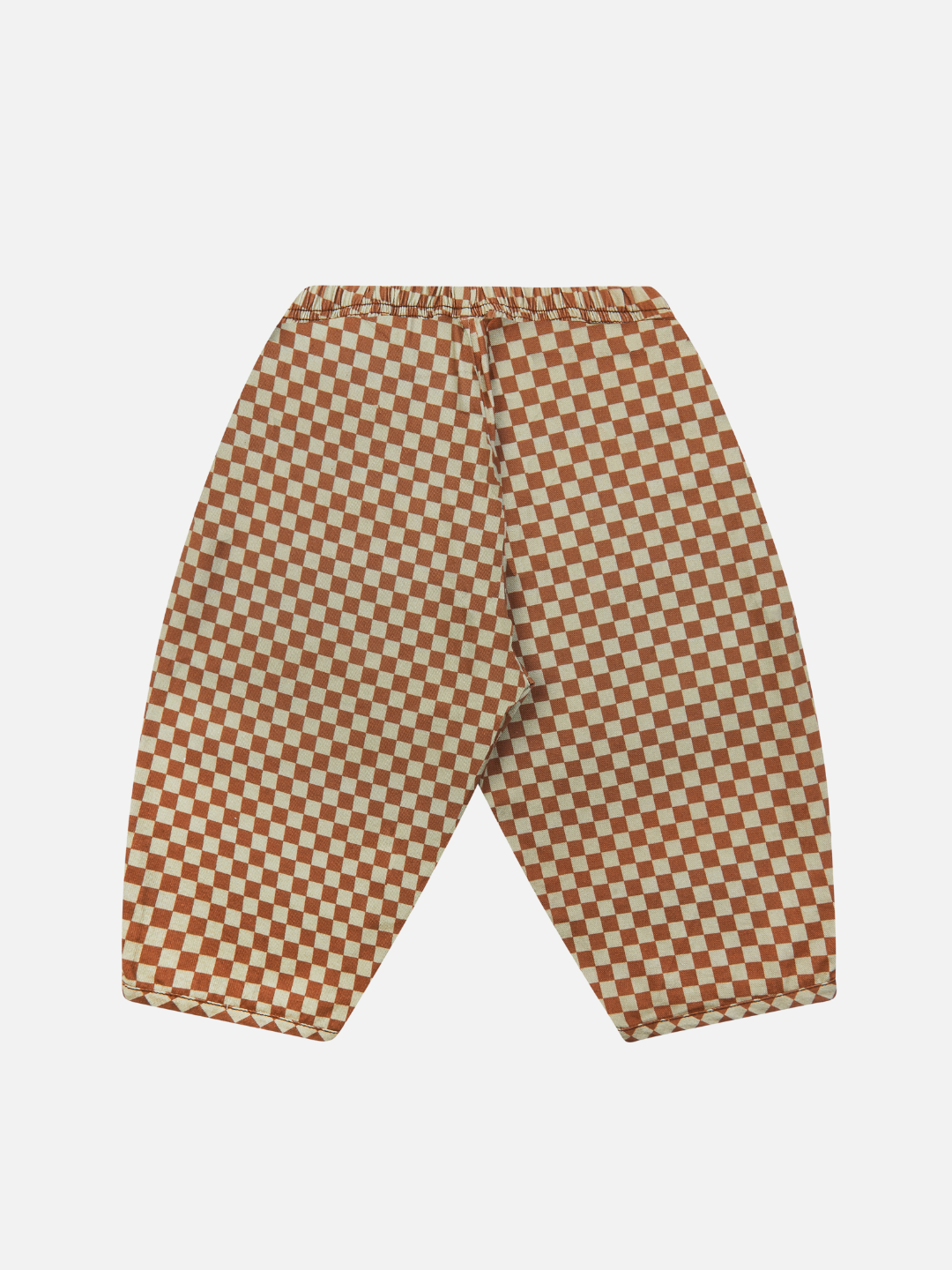 The BRICK CHECK TROUSER features a pair of brown and beige unisex checkerboard pants, skillfully crafted from organic cotton twill. Designed with an elastic waistband, these trousers showcase a loose fit and straight-leg cut for ultimate comfort. The product is displayed against a plain white background.