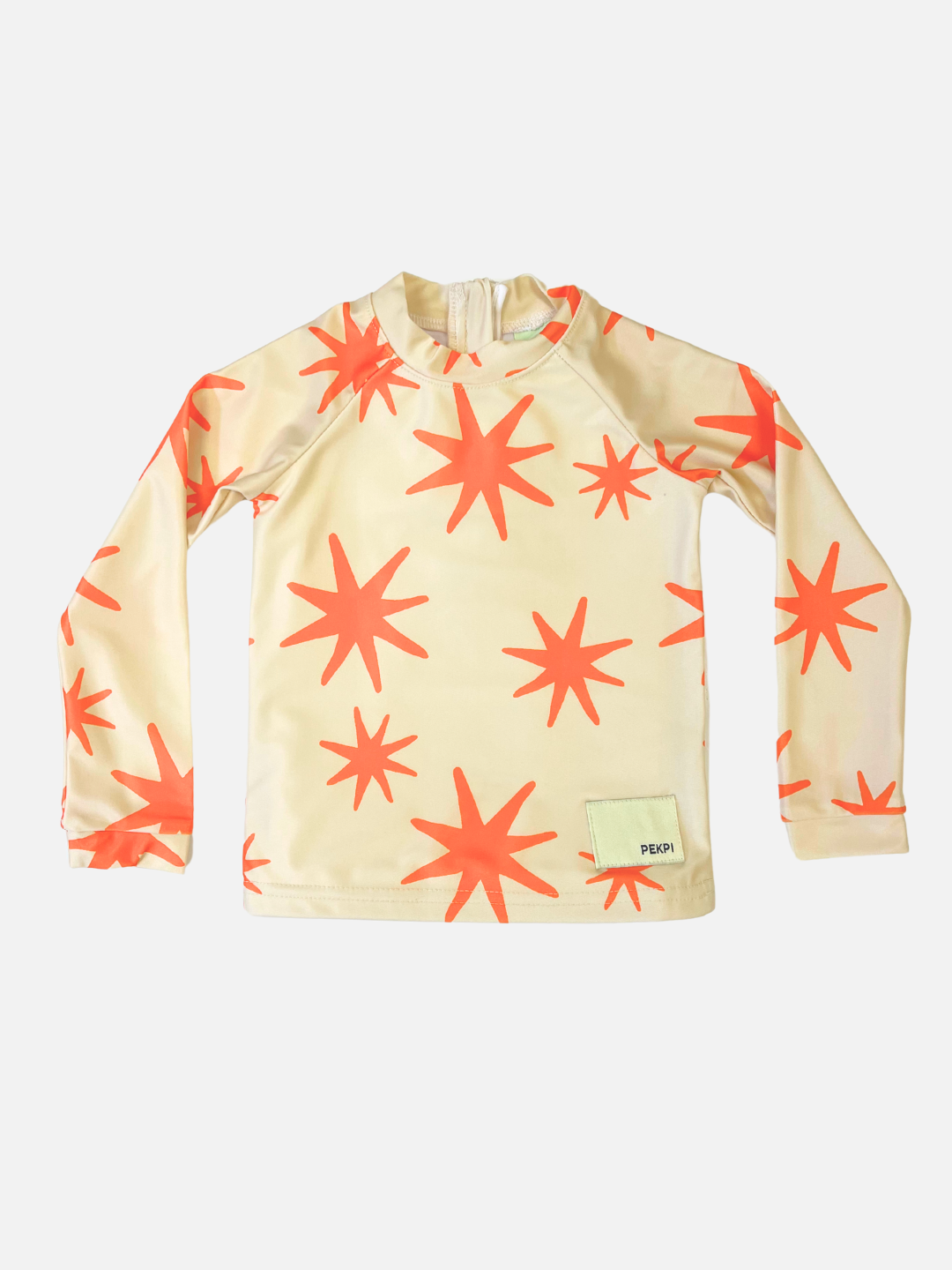 Capri | Capri-colored SWIM RASHIE long-sleeve shirt with bright orange star patterns, crafted from recycled fabric. Features a small label on the lower right.
