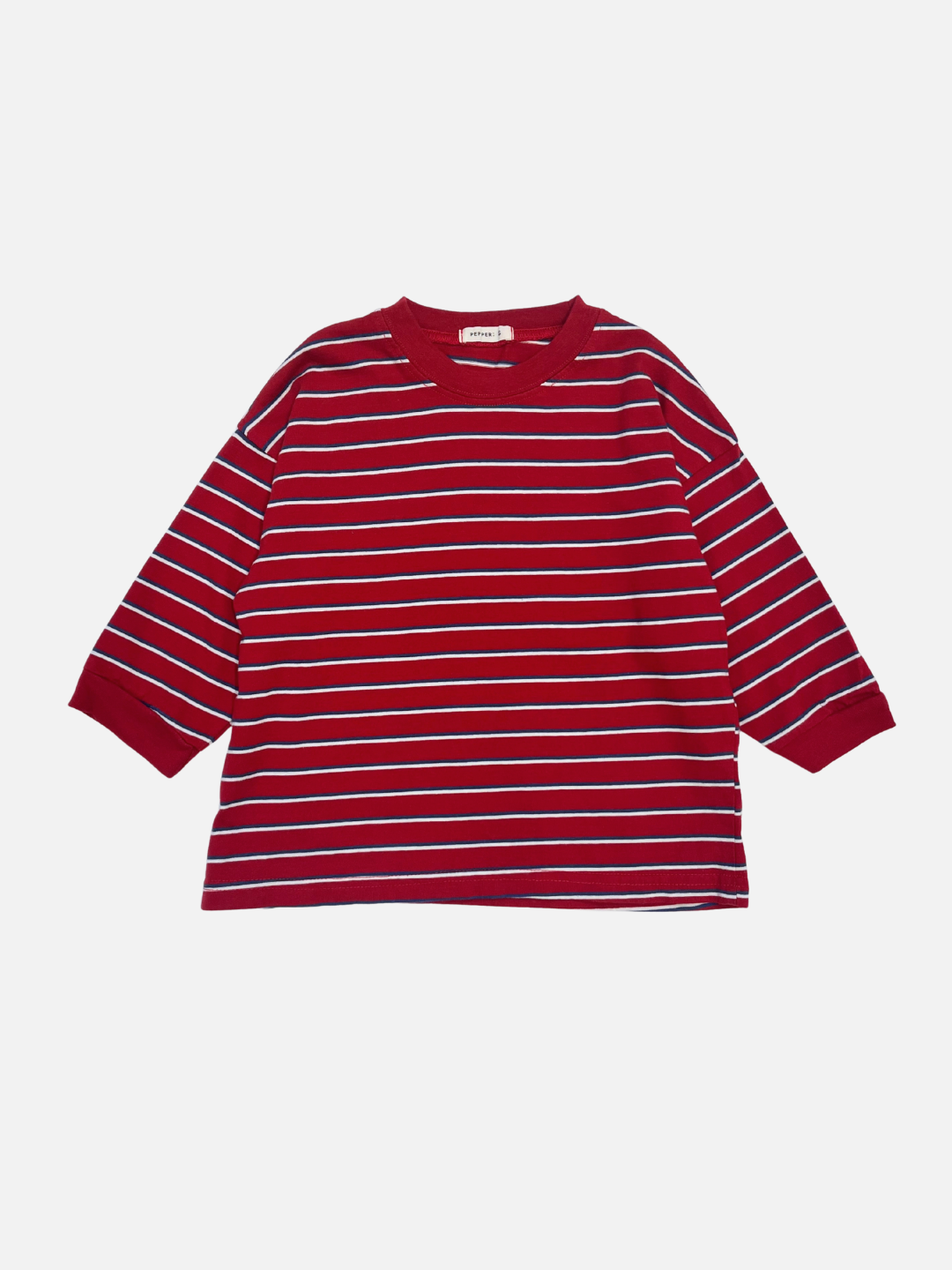 Red | The PEPPER LONGSLEEVE TEE in red, featuring white and navy stripes, is laid flat on a white background; this oversized cotton tee reflects the effortless style of popular Korean kids’ brands.