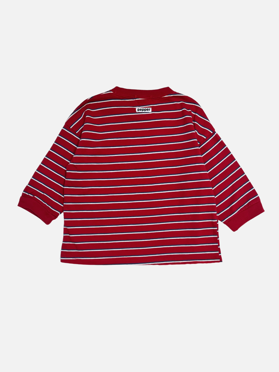 Red | The PEPPER LONGSLEEVE TEE is a red cotton tee from a popular Korean kids brand, featuring white horizontal stripes. It's shown flat and oversized, with the back side facing up.