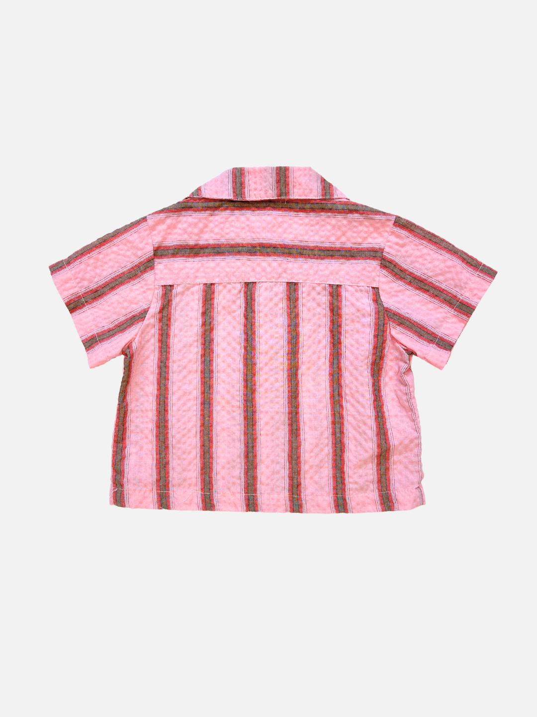 The HAVANA STRIPE SHIRT is a short-sleeved, vintage-inspired pink cotton shirt featuring vertical multicolored stripes, shown flat with the back up on a plain white background.