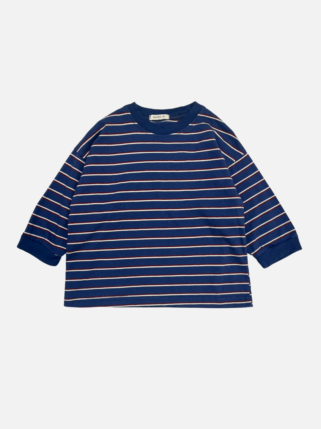 Blue | The PEPPER LONGSLEEVE TEE in blue features white and pink horizontal stripes. This oversized cotton shirt from a popular Korean kids brand is shown laid flat on a white background.