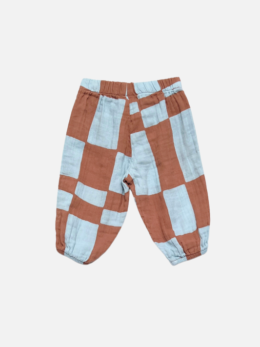 Second image of Blue Checkers | The MUSLIN PULL ON PANT in Blue Checkers features an elastic waistband and a geometric pattern on white organic cotton muslin—ideal toddler jogger pants for playtime or casual outings.