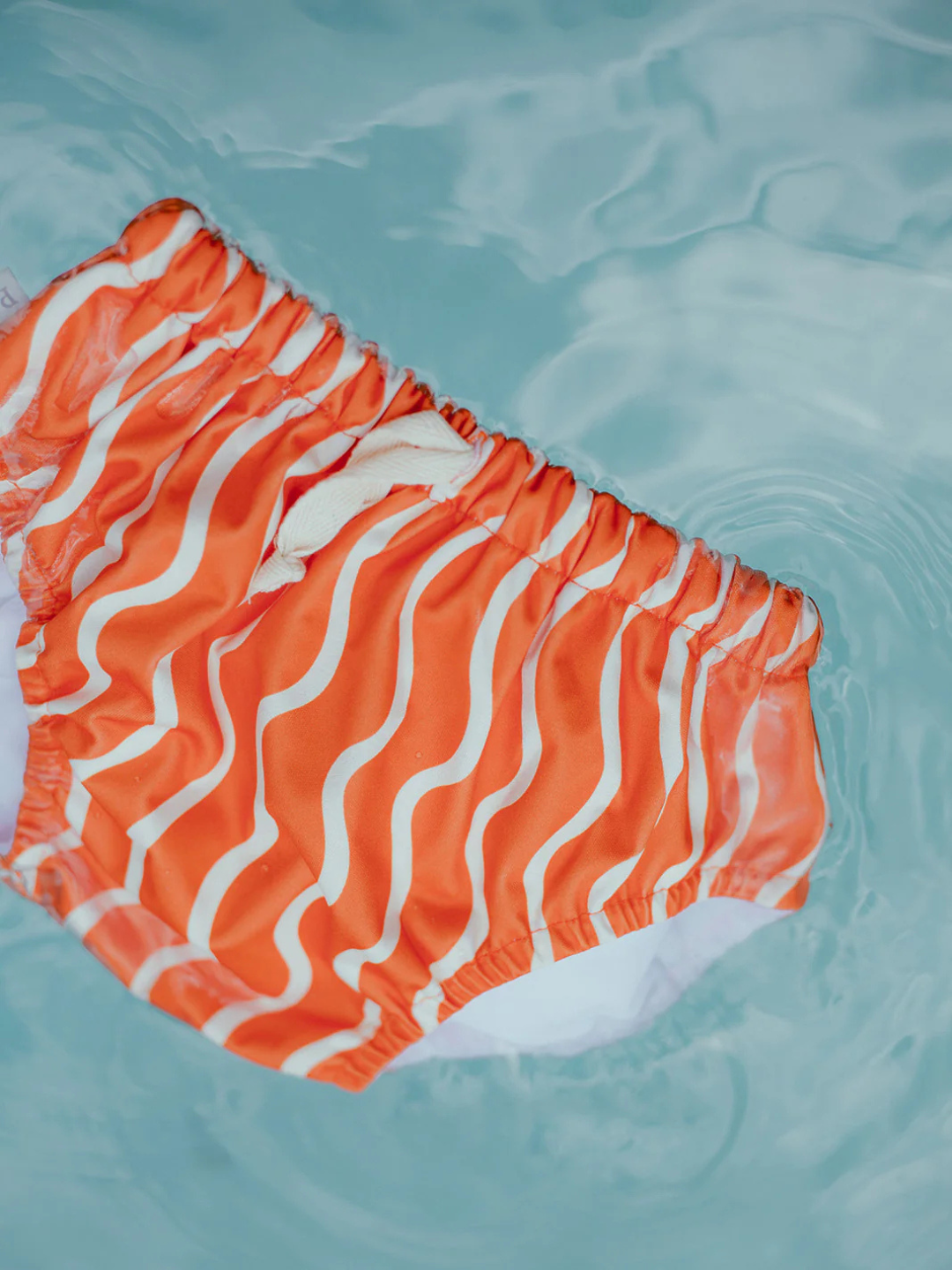 Spaghetti | a swim diaper floating in the pool