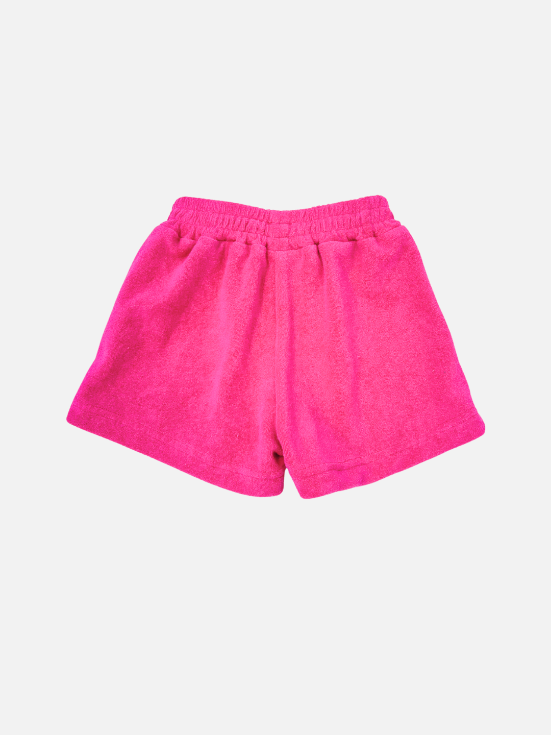 EVERYDAY TERRY SHORTS in bright pink cotton terry with an elasticated waist, shown against a plain white background.