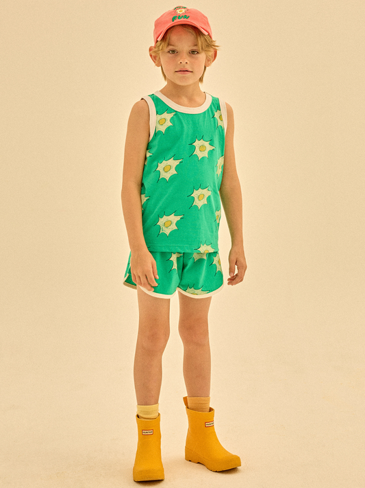 Second image of The EGG SUMMER SET includes a green tank top and shorts with white trim, adorned with a sunny-side-up egg pattern.
