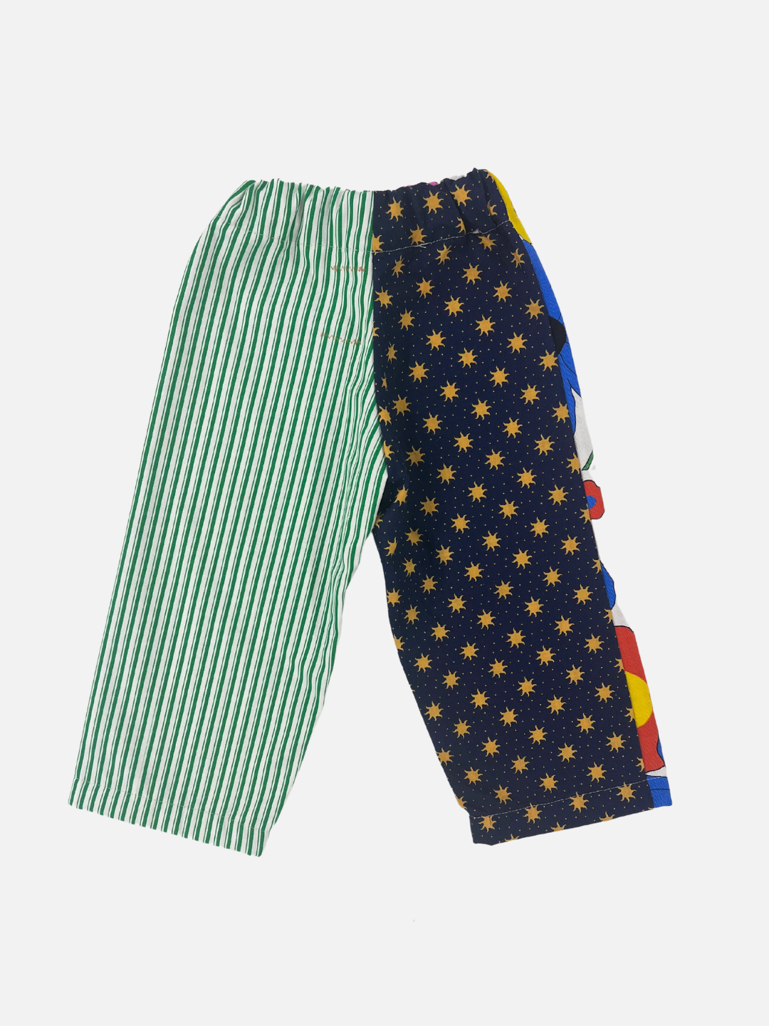 Back view of kid's patchwork pant. Left leg - all over sun print. Right Leg - green stripe.