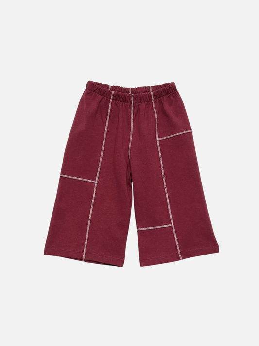 Second image of Maroon | TOPSTITCH BABY PANT in maroon, featuring a wide-leg cotton design, white contrast stitching, and an elastic waistband, displayed on a flat white background.