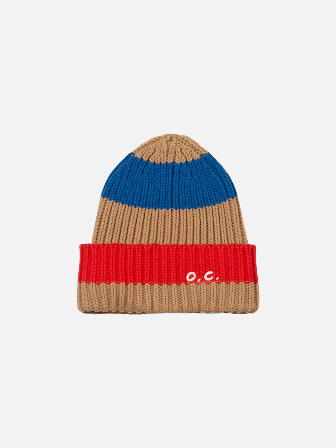 The STRIPED BEANIE is a rib knit hat made from a cotton wool blend, featuring tan, blue, and red stripes with "o.c." embroidered in white on the red fold-over cuff.