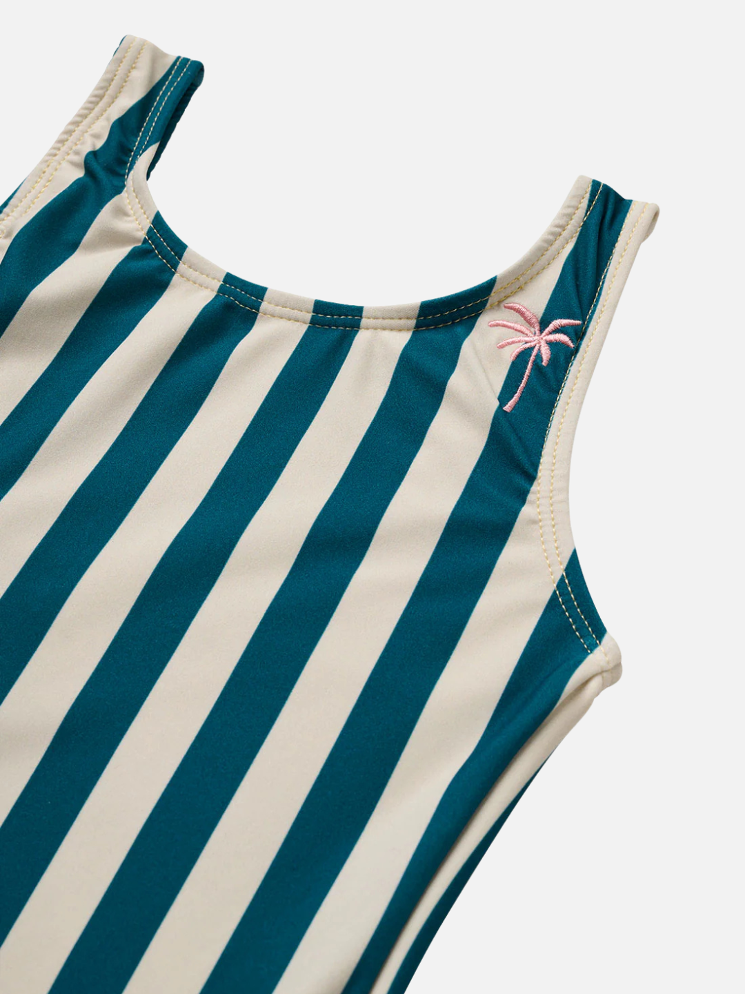 The CABANA STRIPE ONE PIECE SWIMSUIT is a sleeveless, sustainable one-piece with vertical teal and cream stripes and a small pink embroidered palm tree near the shoulder.