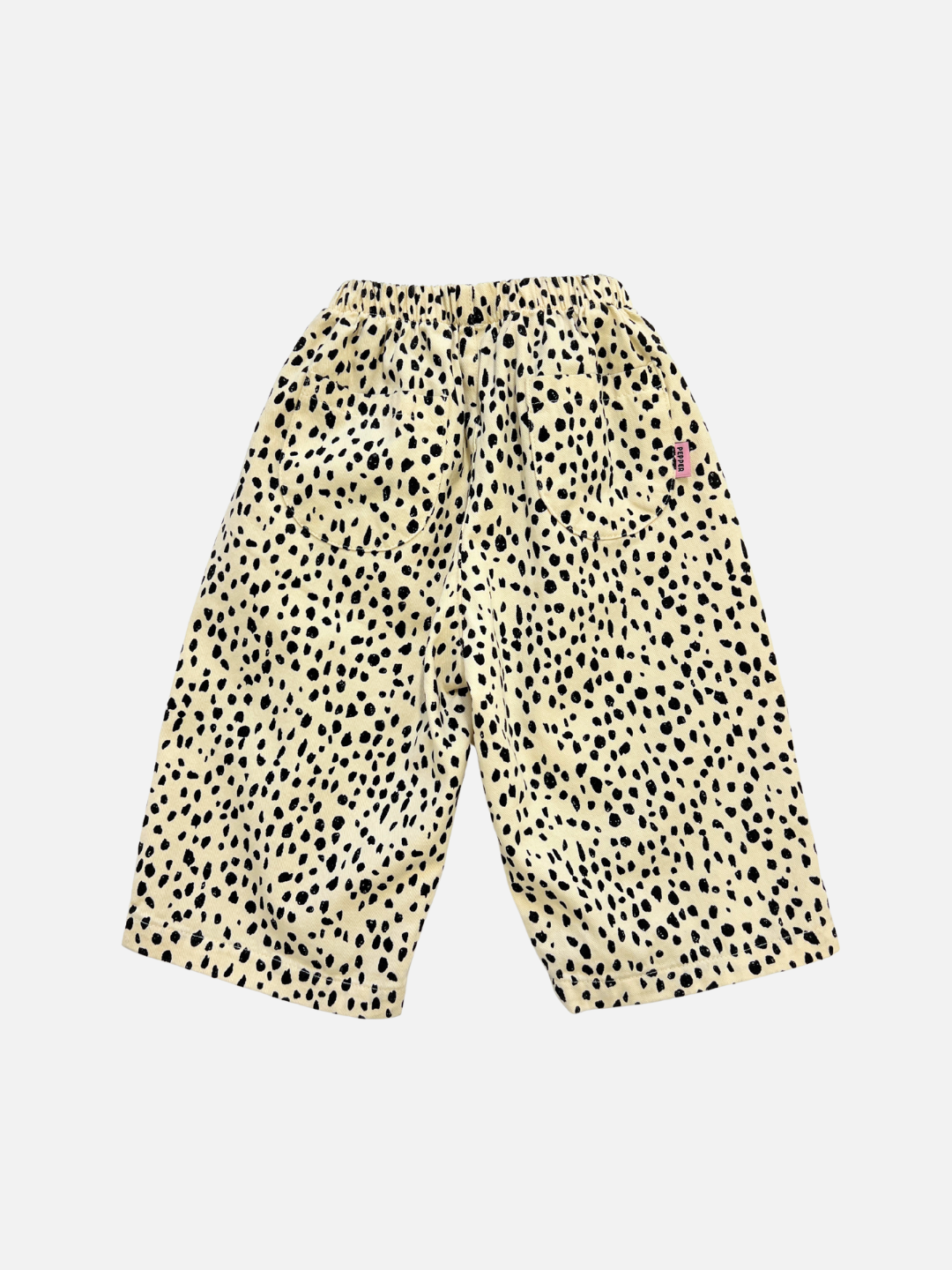 Off-White | The MINI CHEETAH SPOT PANTS are wide-leg cotton twill pants with an elastic waistband, featuring a beige base and black cheetah spots—a playful unisex kids’ style shown on a white background.
