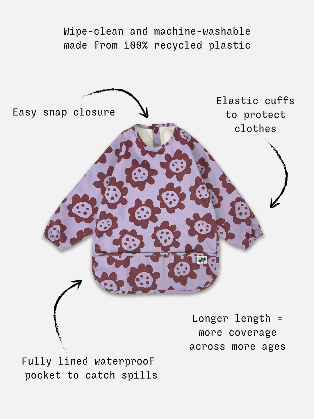 Violet Sunflowers | Detailed information of the long sleeve lavender colored bib with dark purple sunflowers and a front pocket.
