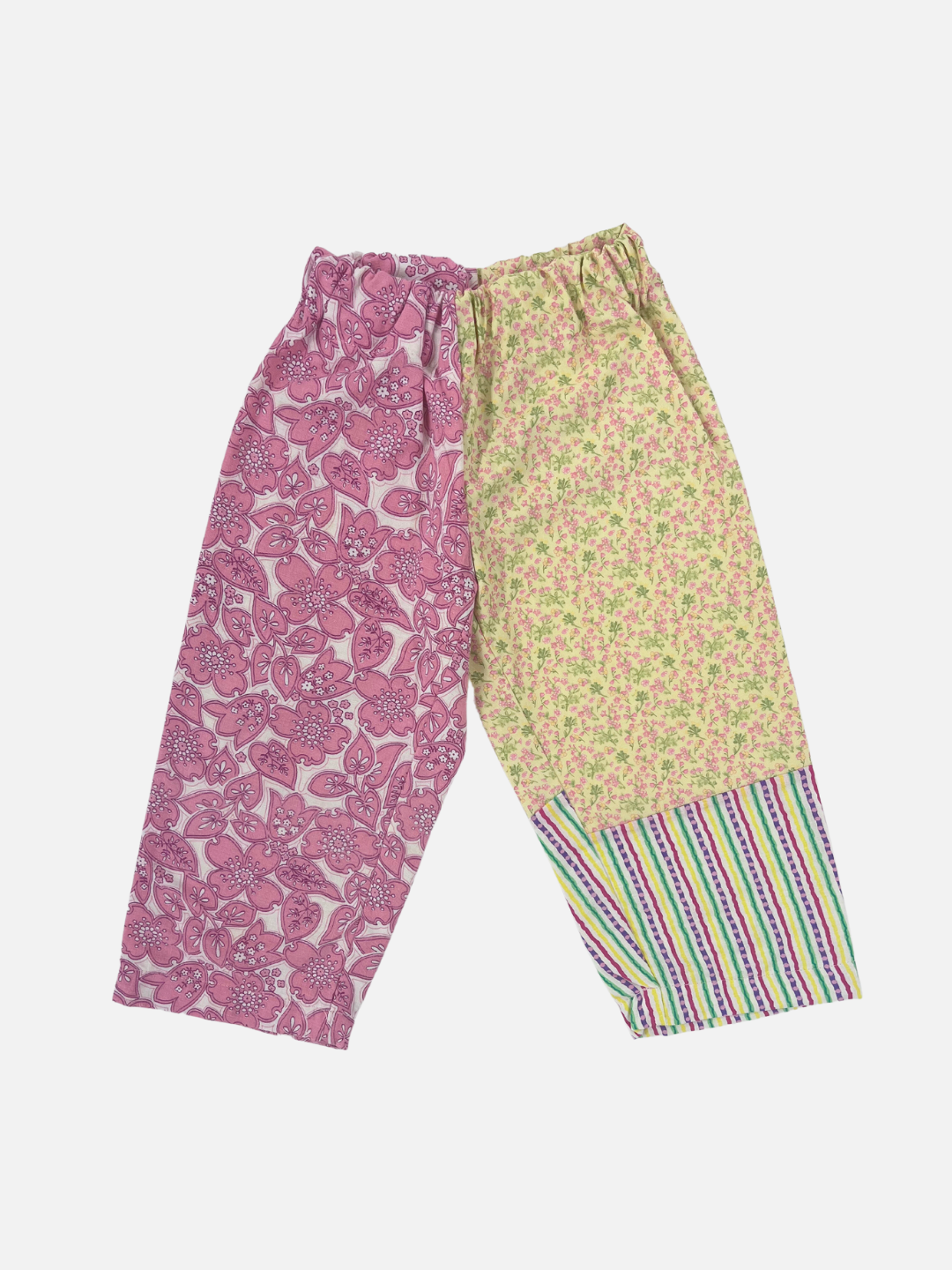 Front view of kid's patchwork pant. Left leg - pink flowers. Right leg - yellow flowers & stripes.