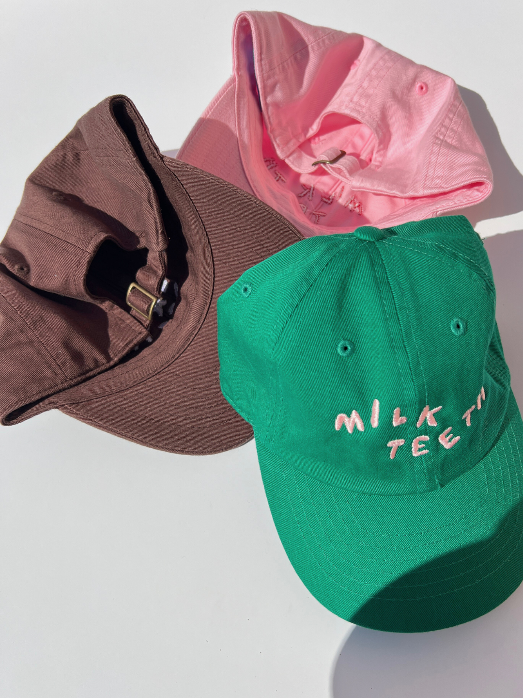 Kelly Green | Three Milk Teeth Caps displaying the adjustable backing
