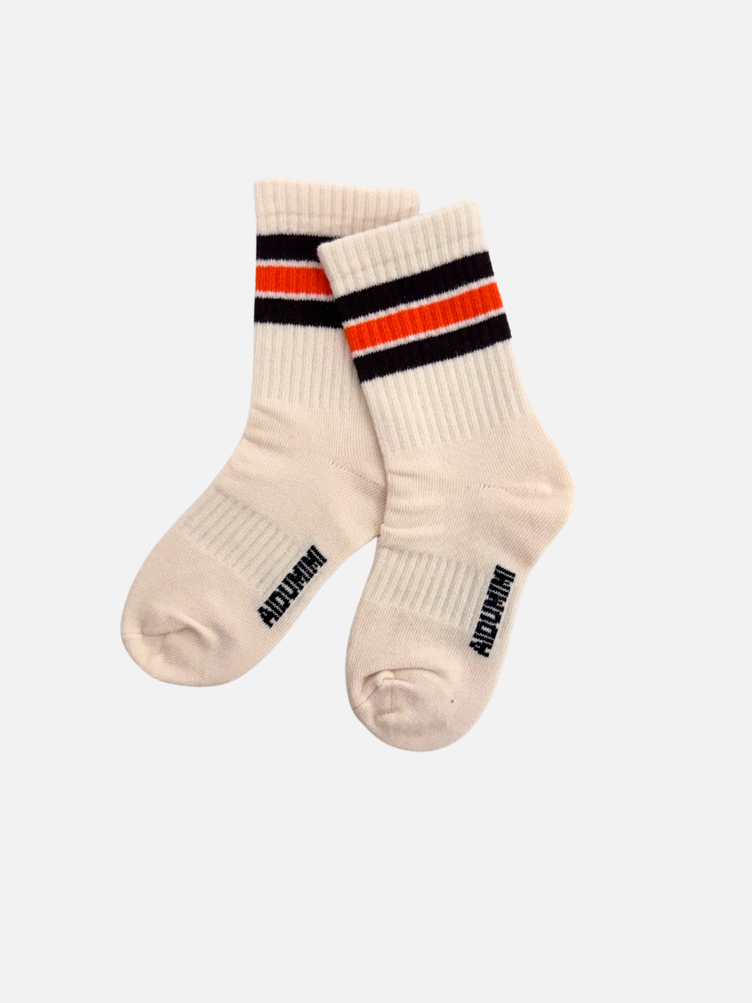 Ivory | The lightweight RETRO SOCKS feature cream coloring with retro ribbed stripes, black and orange accents near the top, and text on the instep.