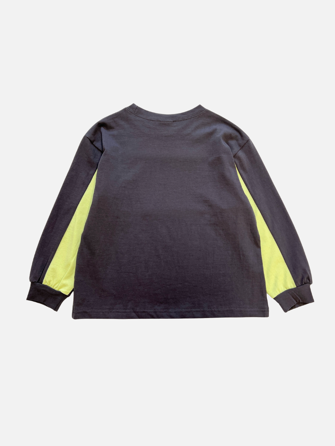 The RACING LONGSLEEVE is a soft black cotton jersey shirt with yellow side sleeve panels, displayed from the back on a plain white background.