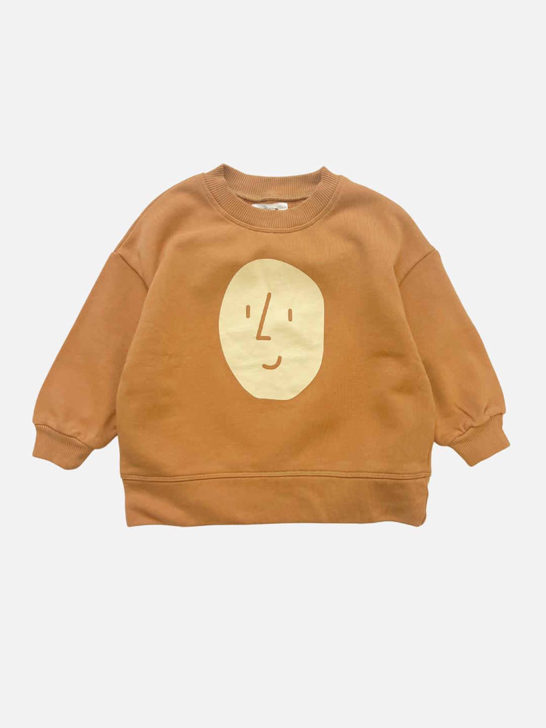 Brown | The POTATO SWEATSHIRT is a brown oversized children's sweatshirt by OXOX CLUB, made from organic cotton and featuring a simple abstract cream face design on the front.