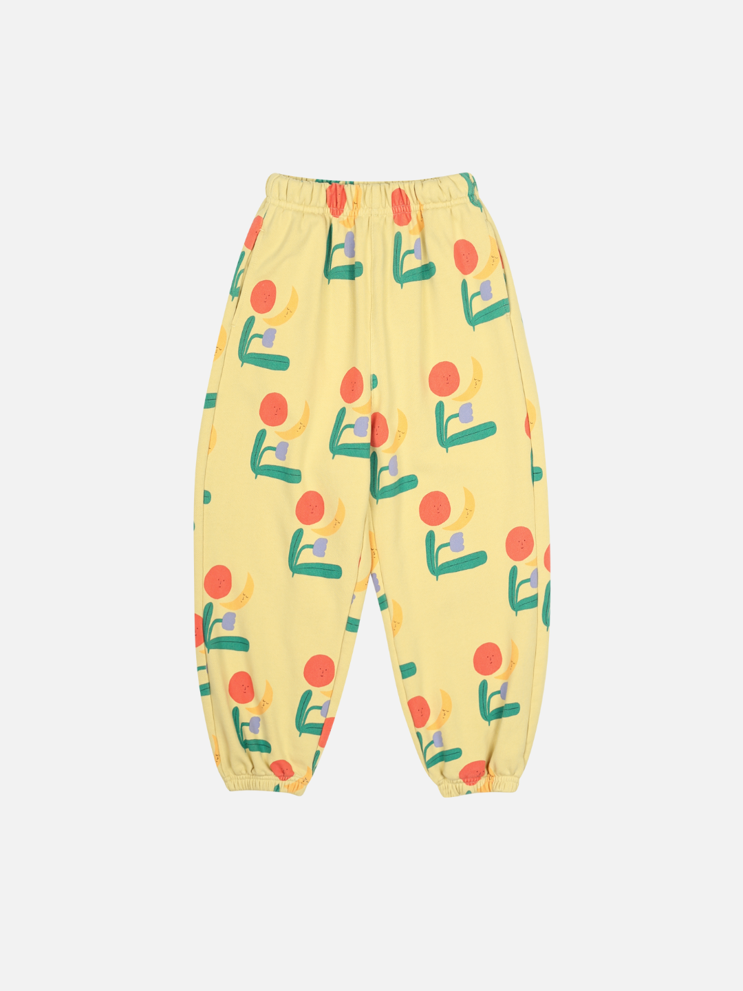 COLORED NATURE ALLADIN PANTS: Yellow elastic-waist pants featuring a colorful abstract print with red circles, green shapes, and yellow accents, displayed on a white background