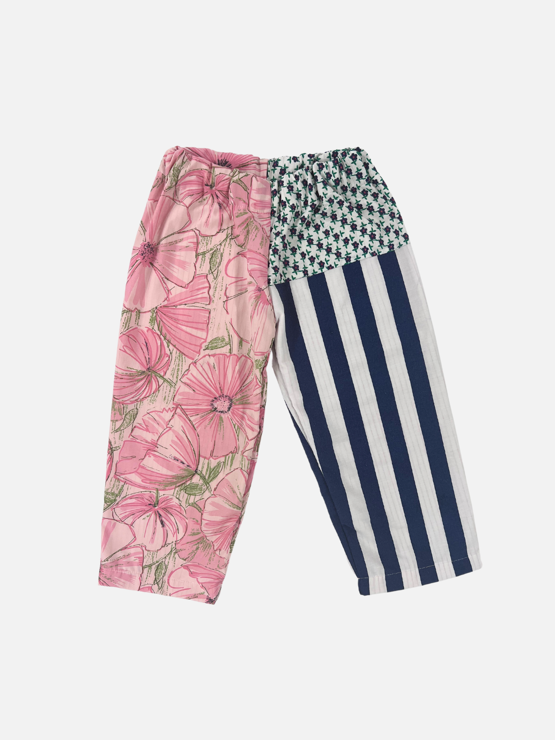 Front view of kid's patchwork pant. Left leg - hibiscus print. Right Leg - navy stripes + little flowers.