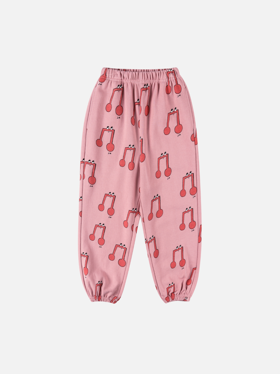 MELODY ALADDIN PANTS: Pink children’s pants with an elastic waistband and cuffs, featuring a fun red cherry print on a white background