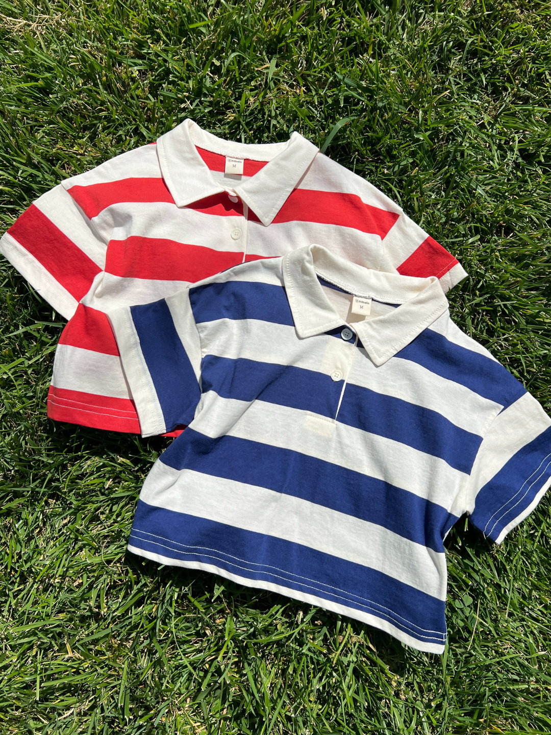 Blue | The RUGBY COLLAR TEE is a Korean kids’ short-sleeve shirt with horizontal red-and-white or blue-and-white stripes, classic collar, and 100% cotton fabric—ideal as a lightweight top for sunny days on the grass.
