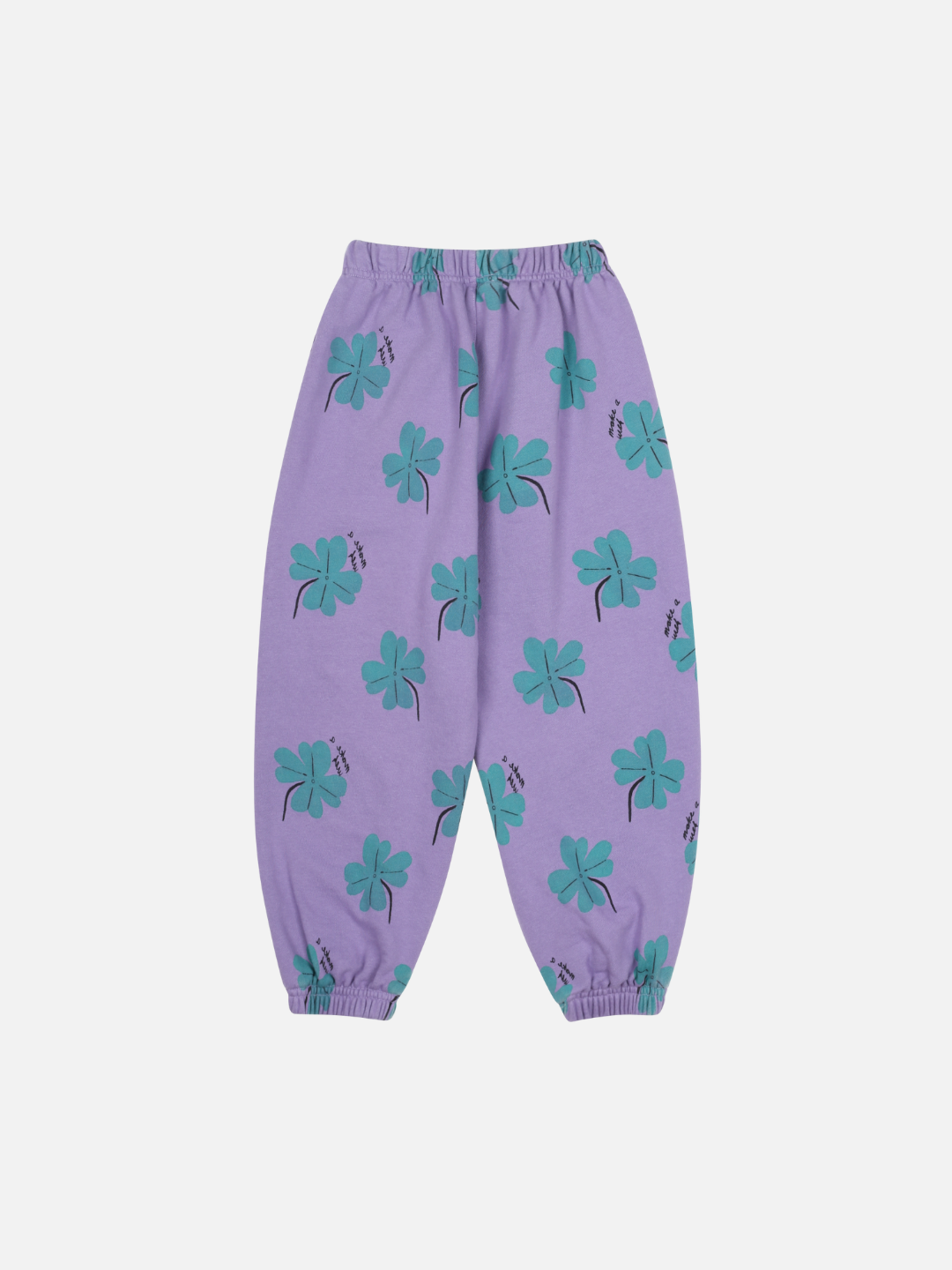 LUCKY CLOVER ALADDIN PANTS: Purple kids' pants with an elastic waistband and cuffs, adorned with a green four-leaf clover print