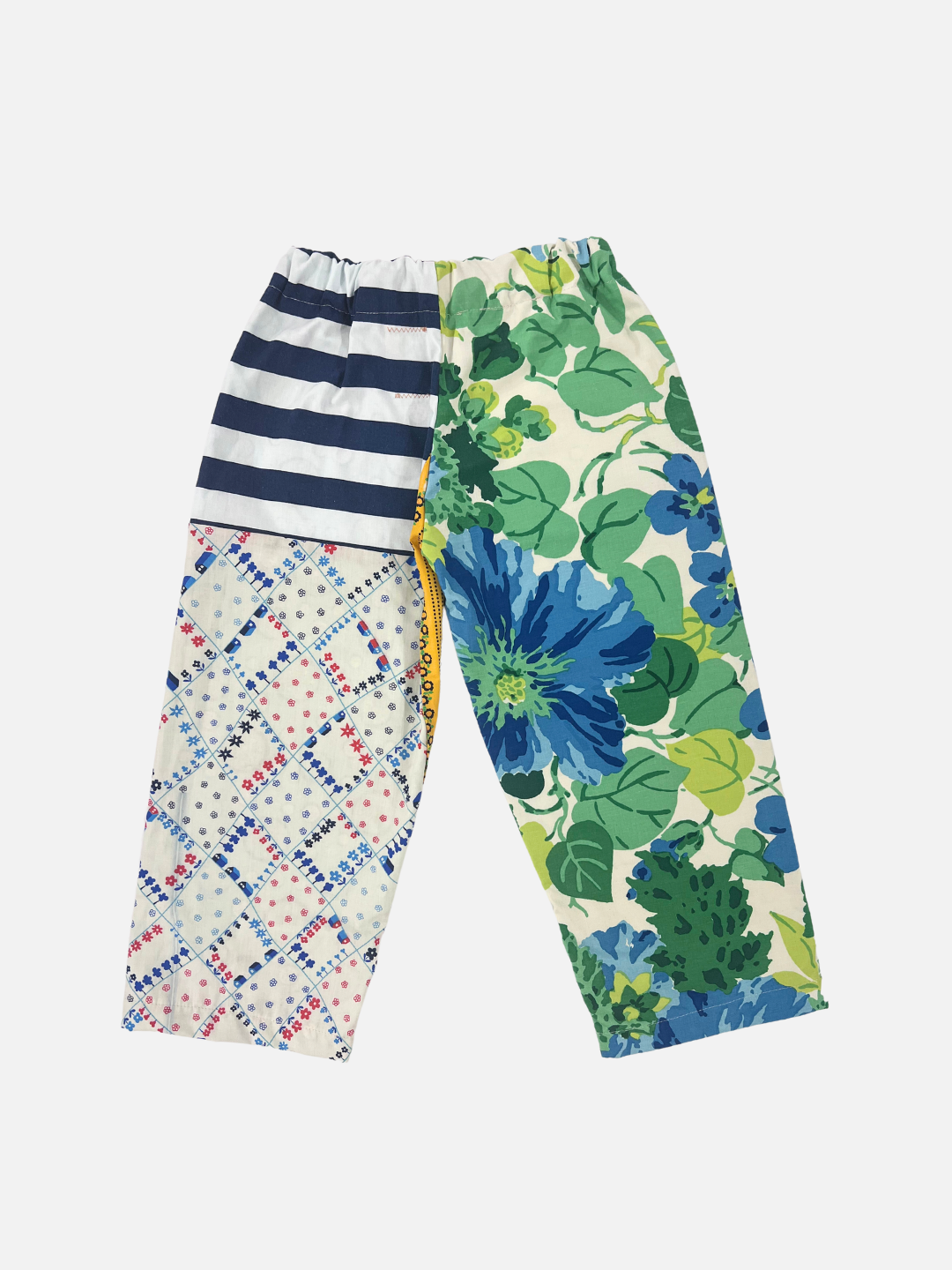 Back view of kid's patchwork pant. Left leg - big floral print. Right Leg - green stripe.