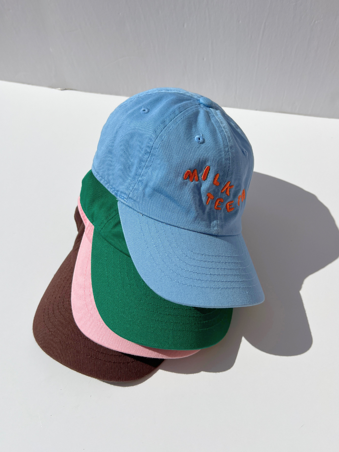Sky Blue | A stack of Milk Teeth embroidery caps