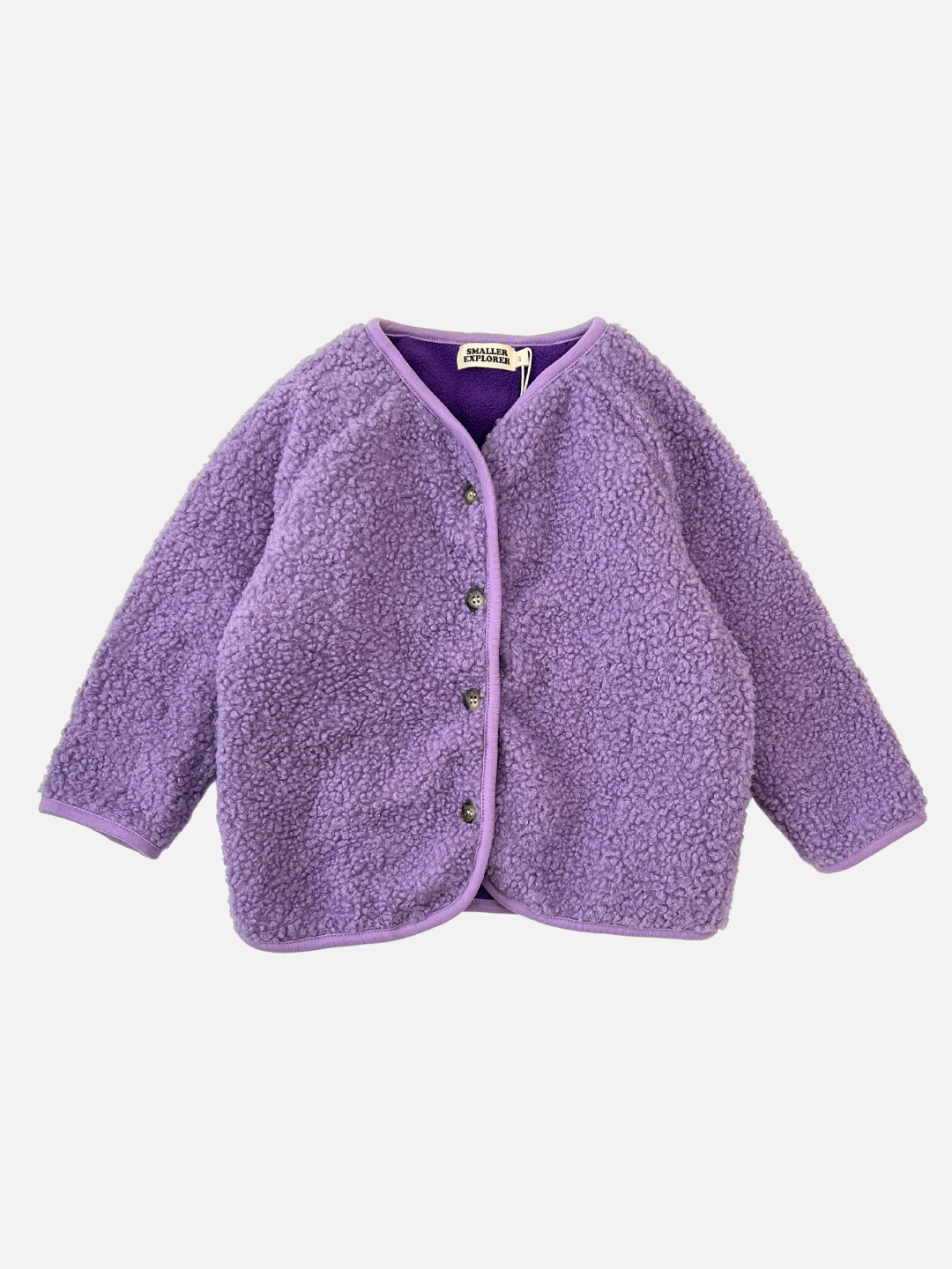 Lavender | Front view of a kids purple collarless fleece jacket with four brown buttons.