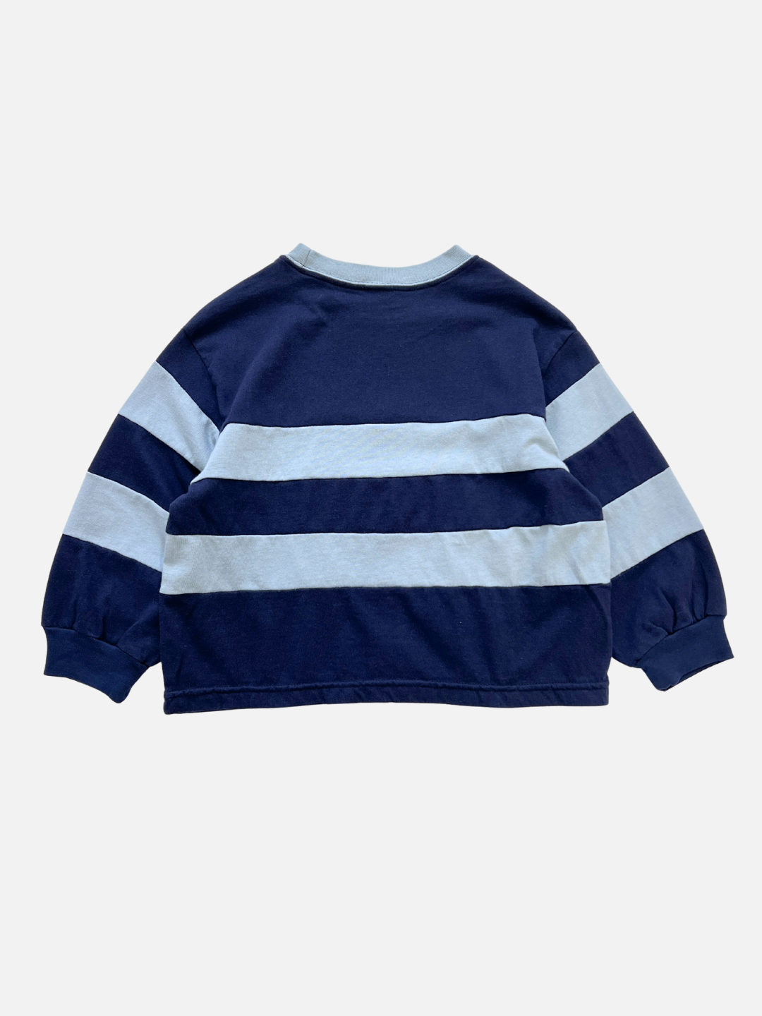 The RINGER LONGSLEEVE is a boxy navy blue longsleeve tee with wide light blue horizontal stripes, made from medium-weight cotton and shown flat from the back.