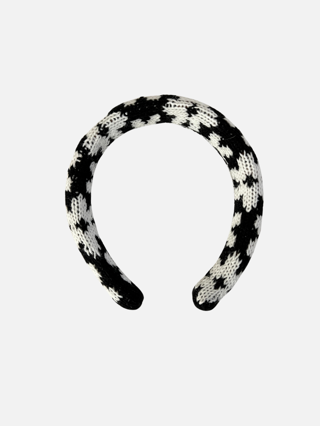 Black/White Blossoms | A kids' knitted headband in a pattern of white flowers on a black background