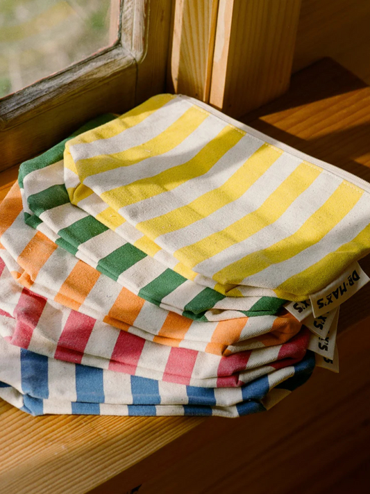 Second image of Blue | The ORGANIC COTTON ZIPPER BAG in blue features vertical stripes, a secure top zipper, and is made from durable organic cotton—ideal for organizing diaper bags.