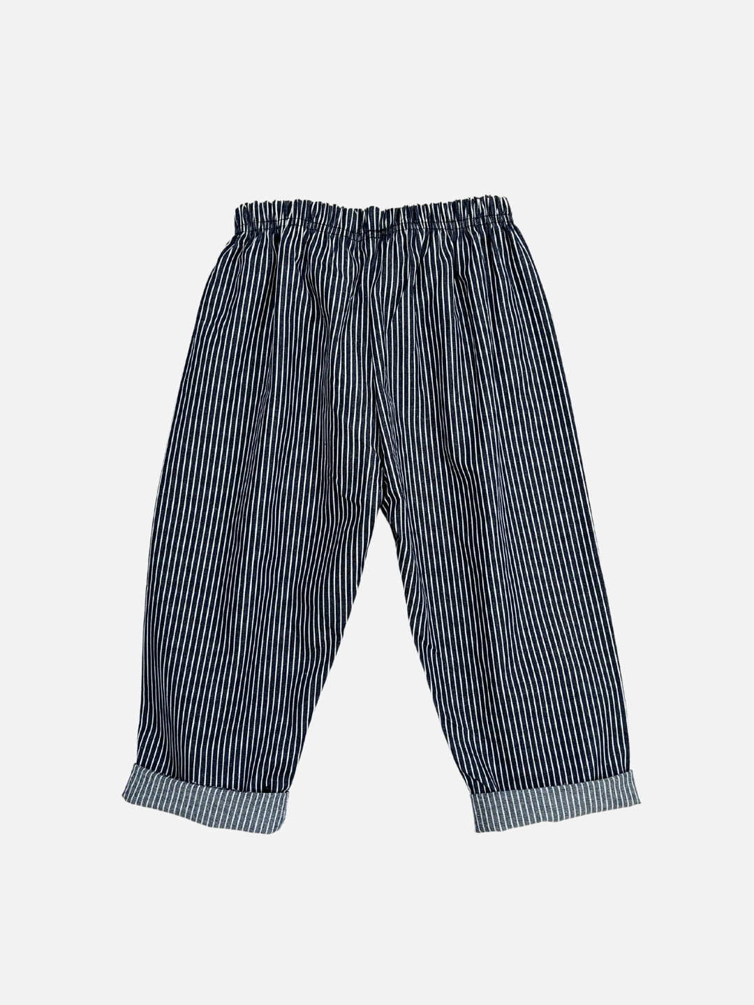 Navy | Back view of kids dark blue pants with narrow white vertical stripes, cuffed at the ankle.