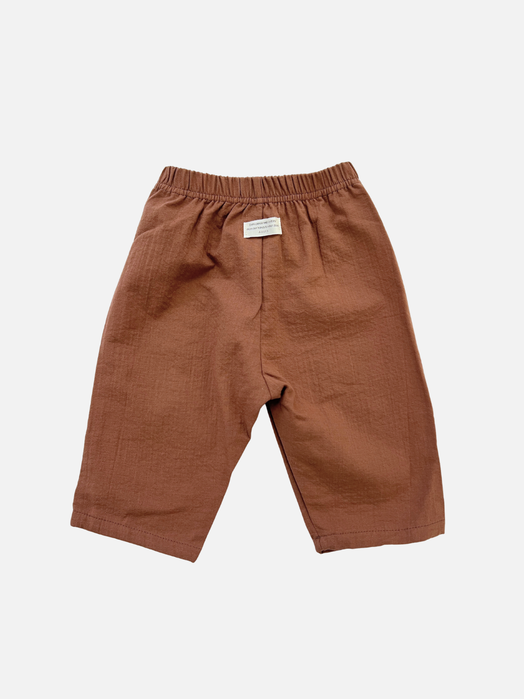The CLOUD COTTON PANT in Chocolate features a relaxed fit, breathable woven cotton fabric, and an elastic waistband, shown against a plain white background.