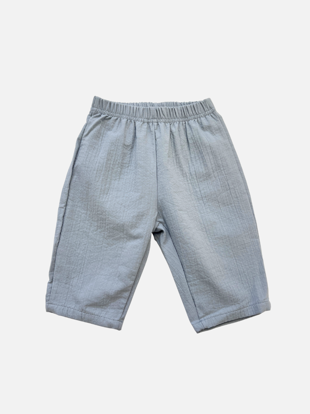 The CLOUD COTTON PANT in Sky features a relaxed fit and elastic waistband, crafted from breathable woven cotton, shown laid flat on a white background.