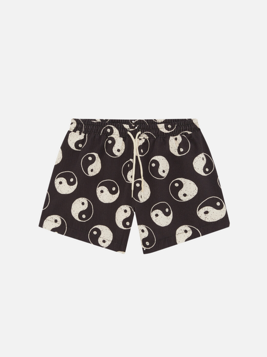 Image of A front view of the elastic drawstring black shorts with a yin and yang pattern all over.