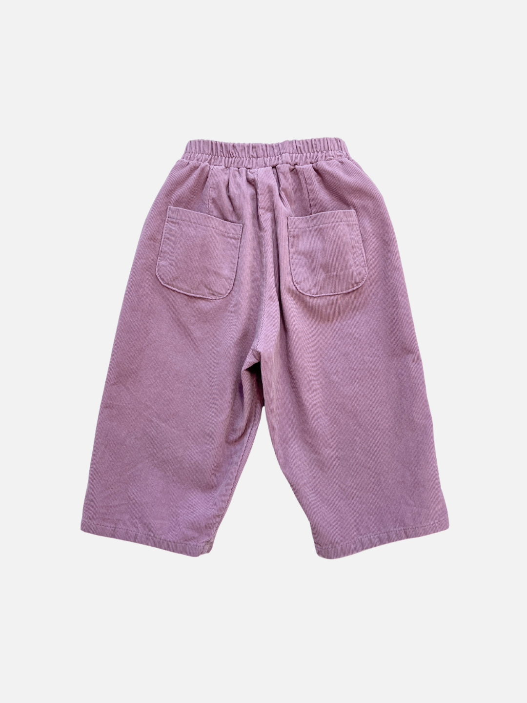 The SIMPLE CORDUROY PANTS are loose-fitting, light purple cotton corduroy pants with an elastic waist and two back pockets, from a popular Korean kids brand, shown on a plain white background.