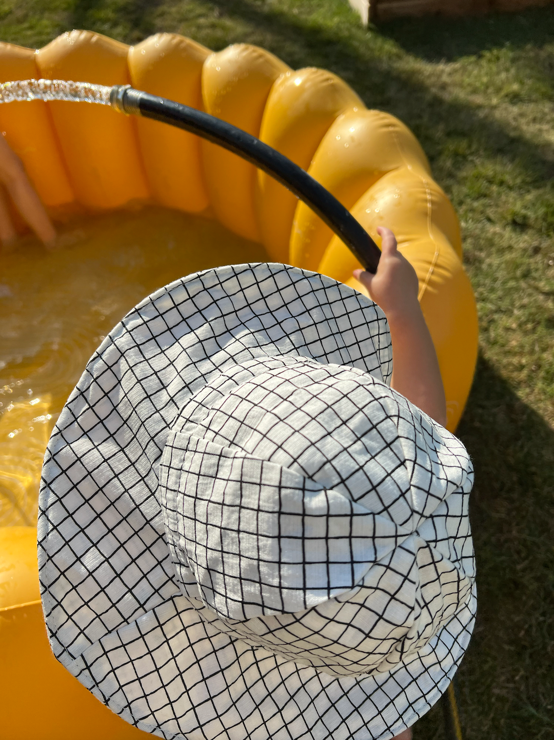 White | A child is wearing the off the grid hat