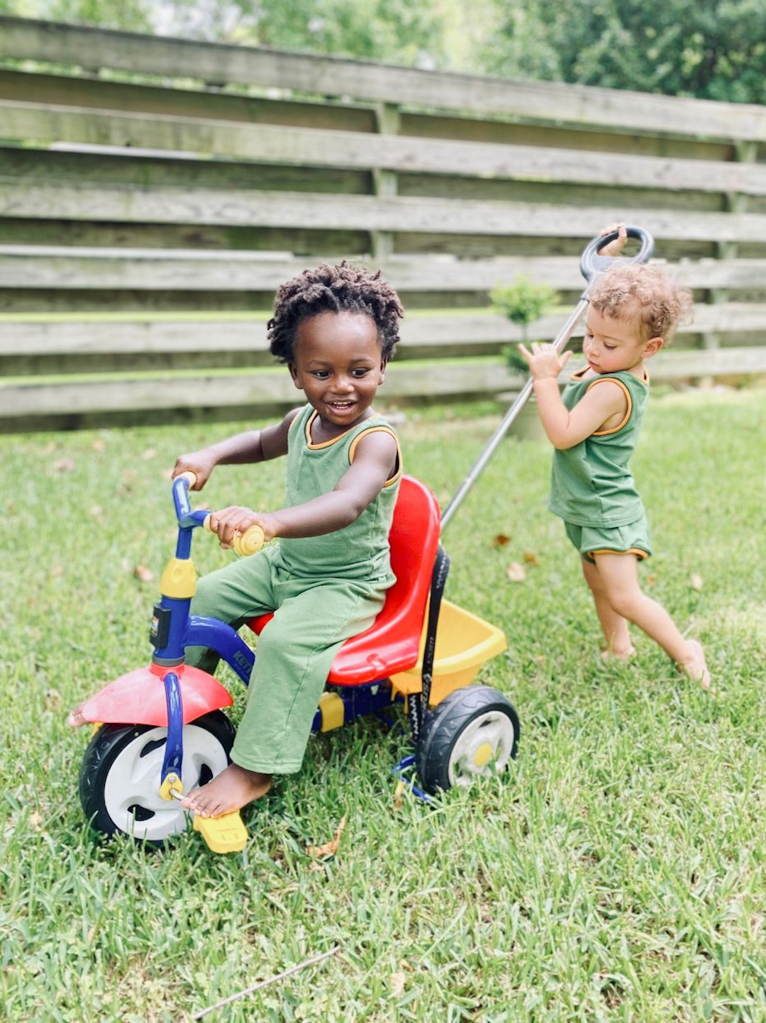 Mint | Child in mint green kids' tank and bloomers pushing child in mint green tank and pants on tricycle